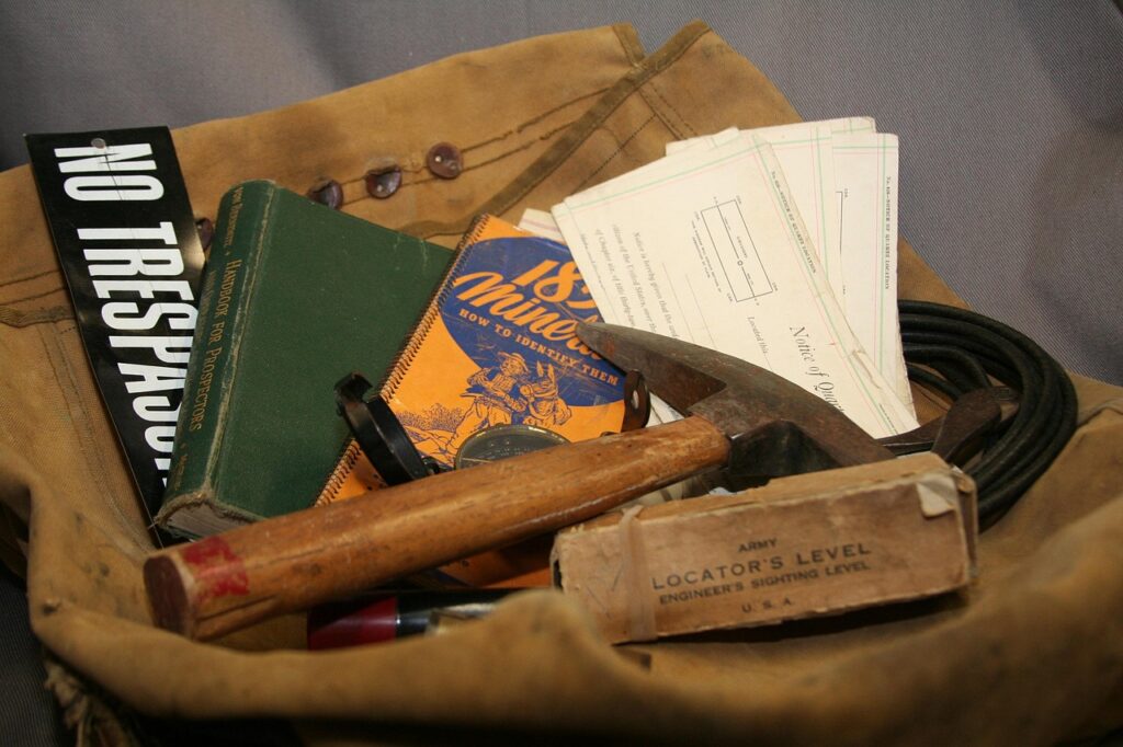 mineral collecting tools in field bag